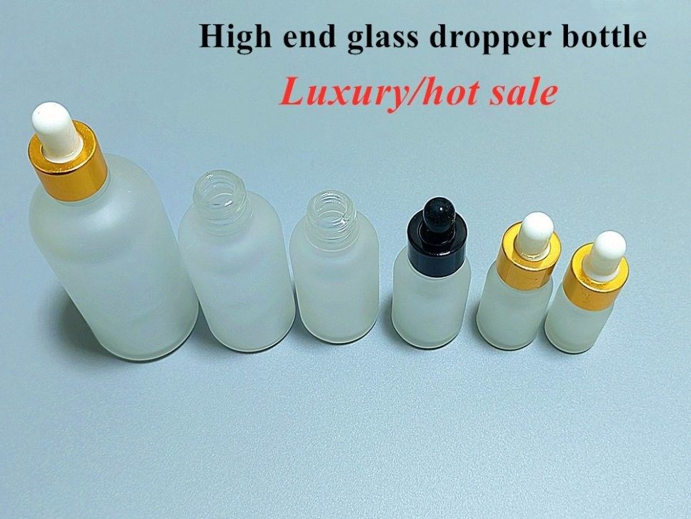 10 ml 20 ml 30 ml 50 ml 100 ml Bouteille d' huile essentielle en verre d' épaule oblique Bouteille de gouttelette glacée blanche pour soins de la peau au sérum